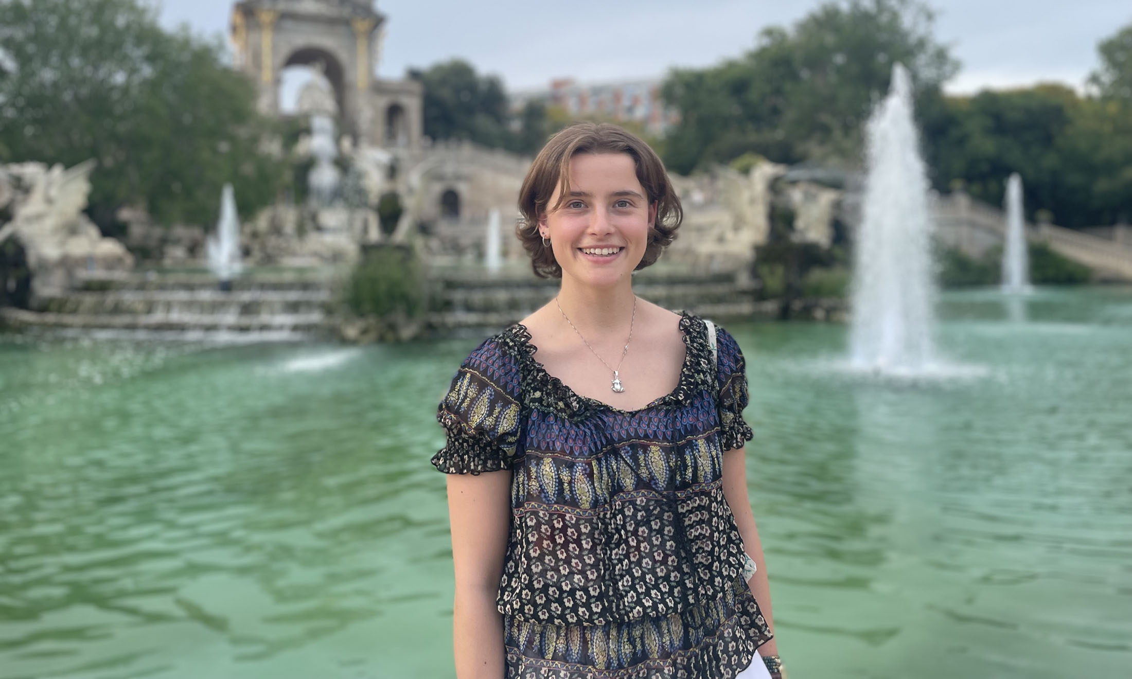 Lillian Lesperance Solomonson poses for a photo in front of a fountain.