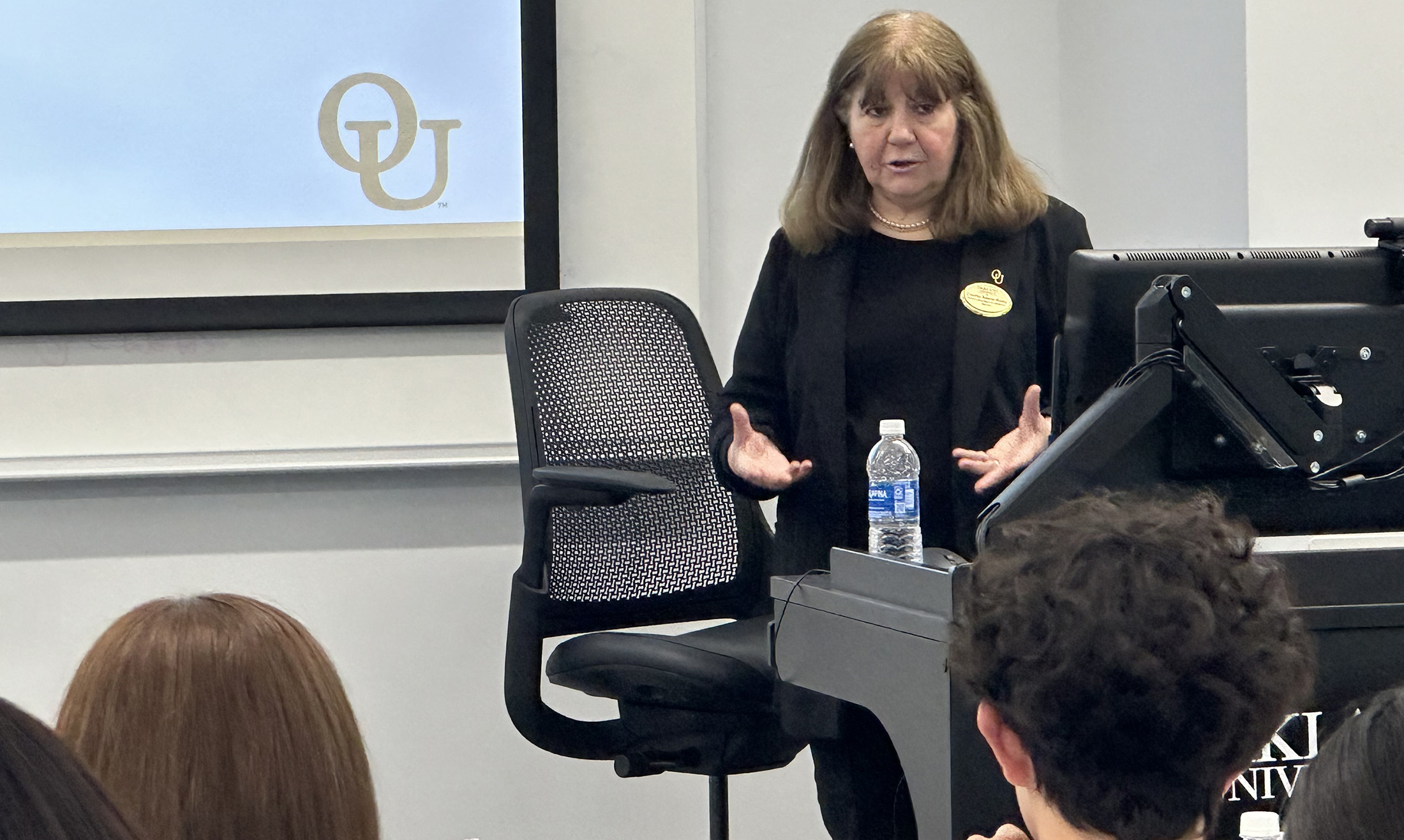 Oakland Associate Professor of Spanish Cecilia Saenz-Roby gives a presentation to a group of students.