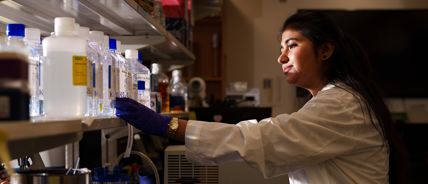 A woman working in a chemical lab