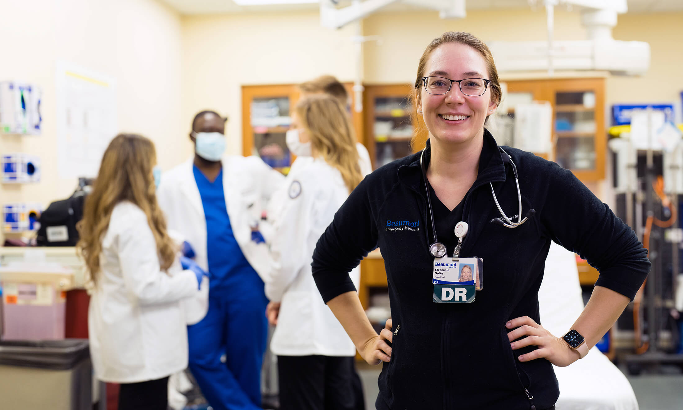 Dr. Goike with OUWB students in the background