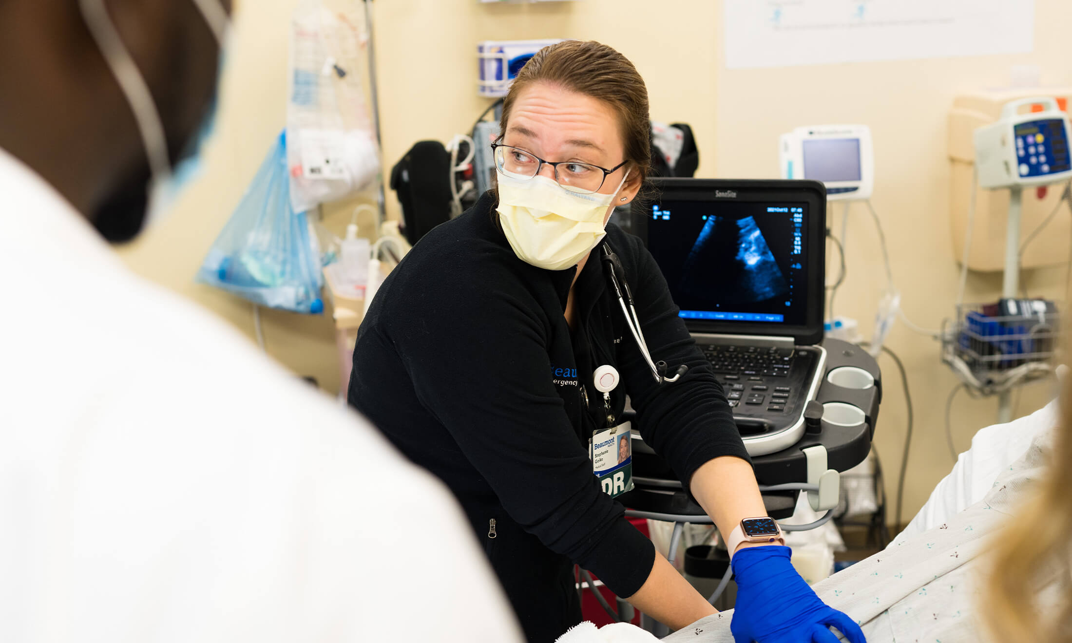 Dr. Goike examines a patient.