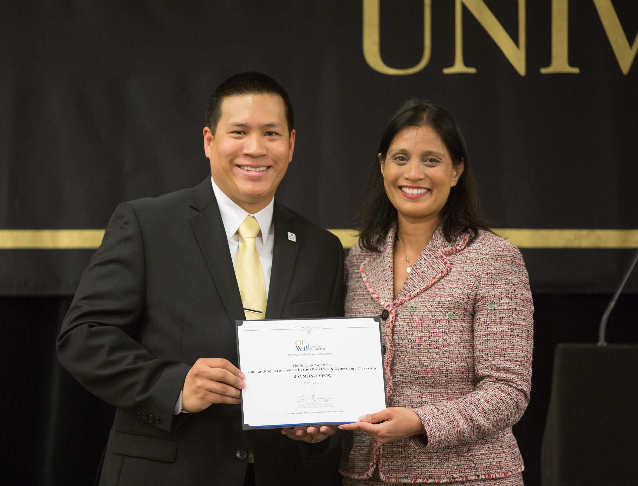 Raymond Yeow, M.D., receiving an award.