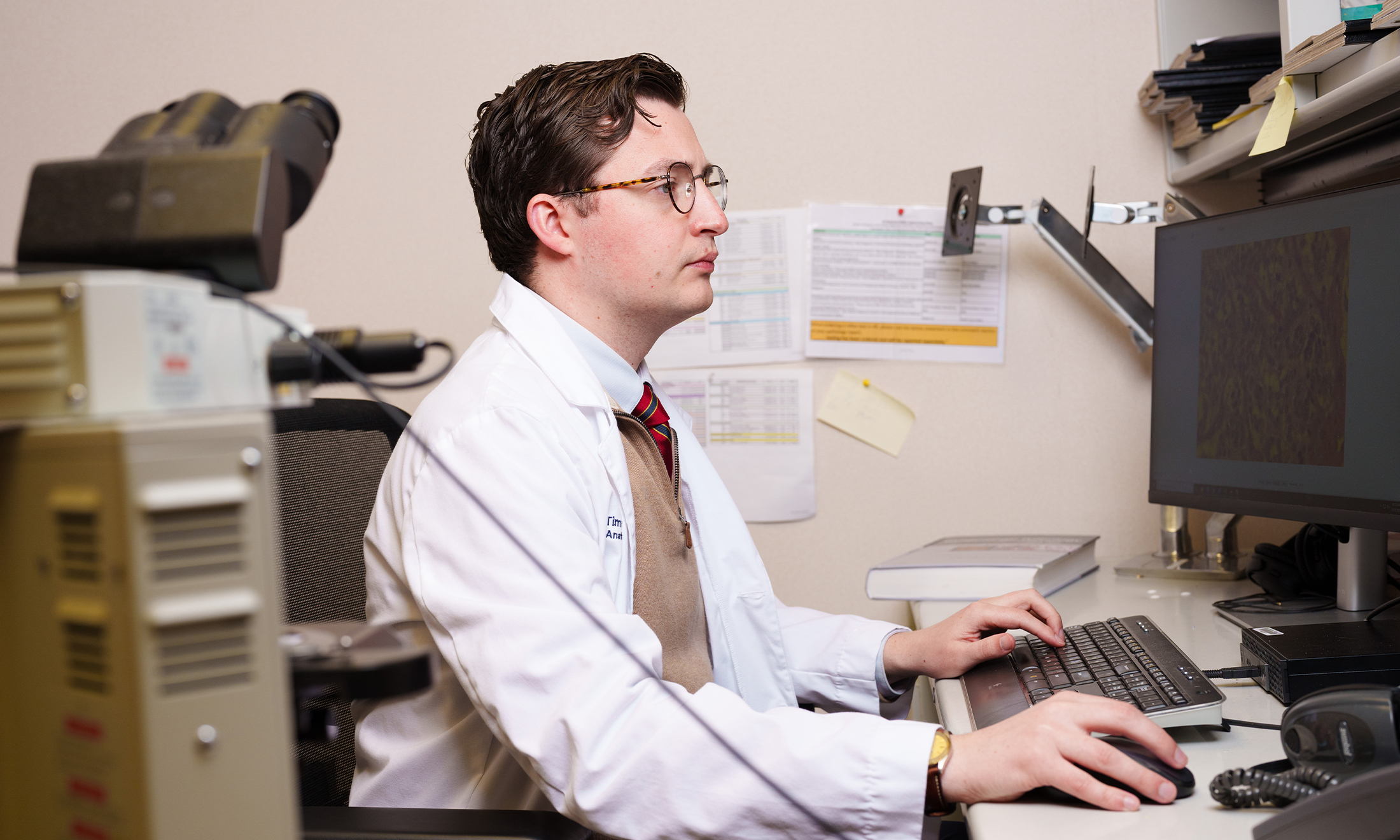An image of Dr. Helland at a desk