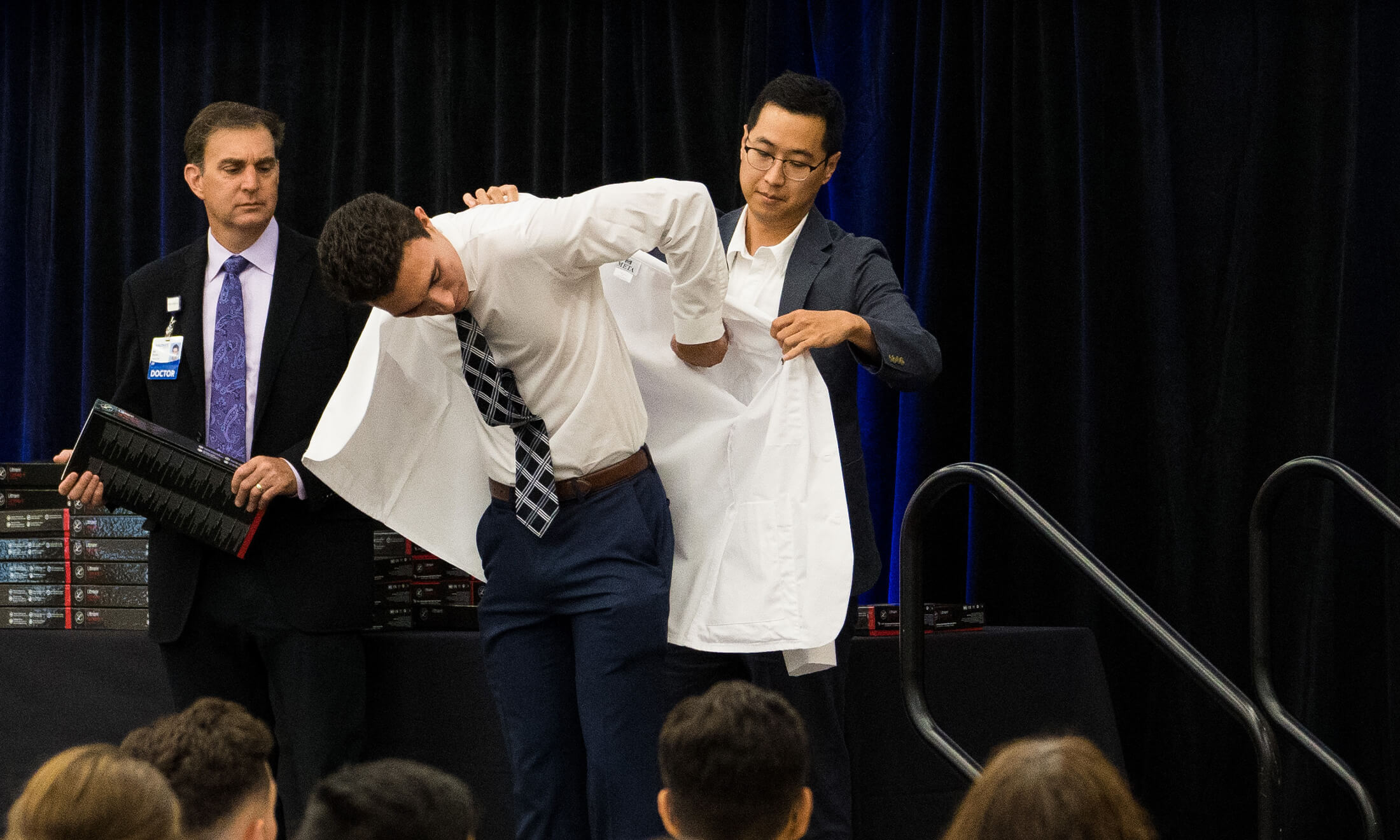 Student getting a white coat