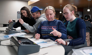 Students assembling clean birthing kits