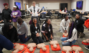 Students practicing hands only CPR