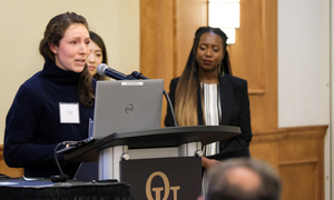 A student speaks at a podium