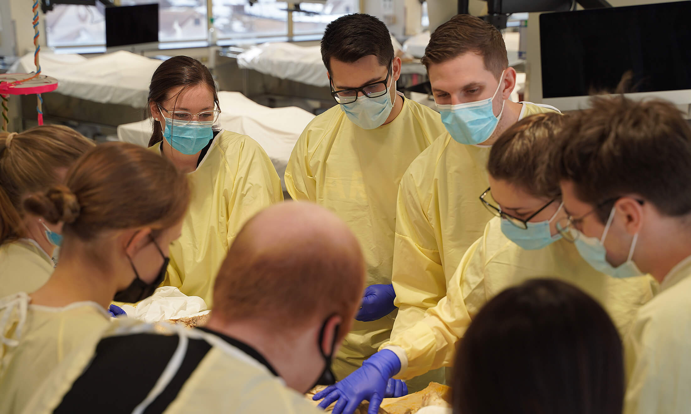 A group of students in OUWB's anatomy lab.