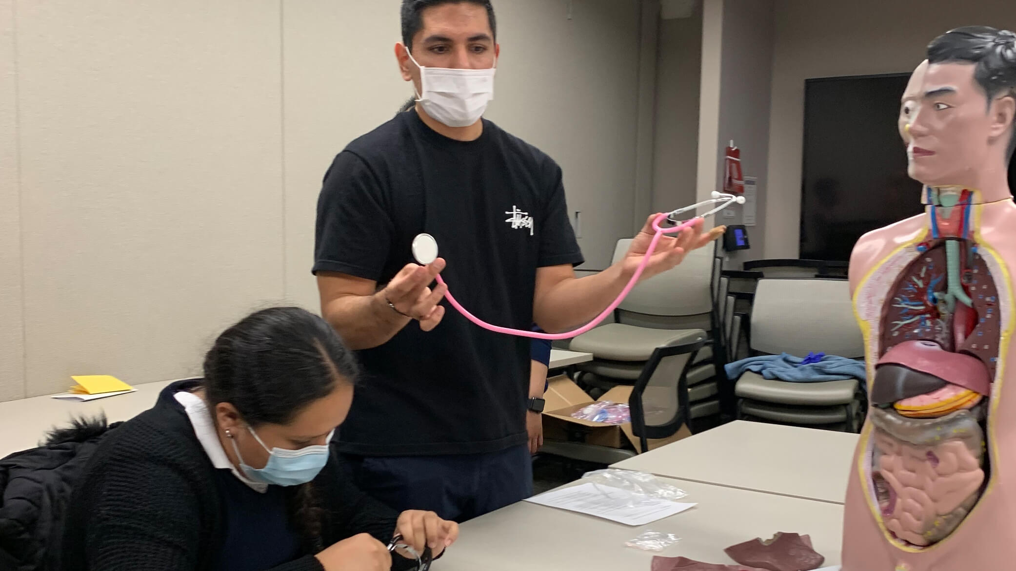 An image of a student talking about a stethoscope