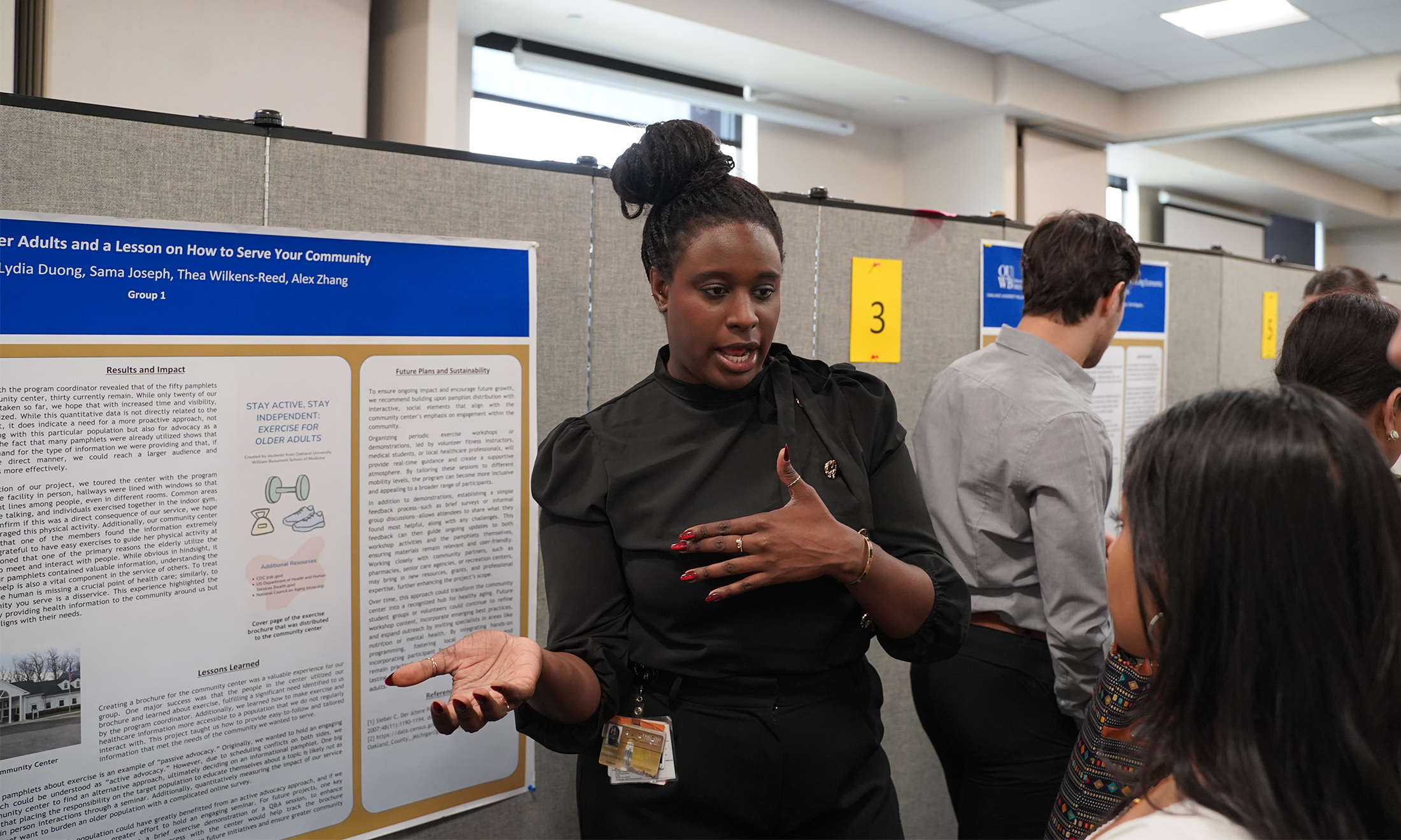 An image of a student talking about her poster