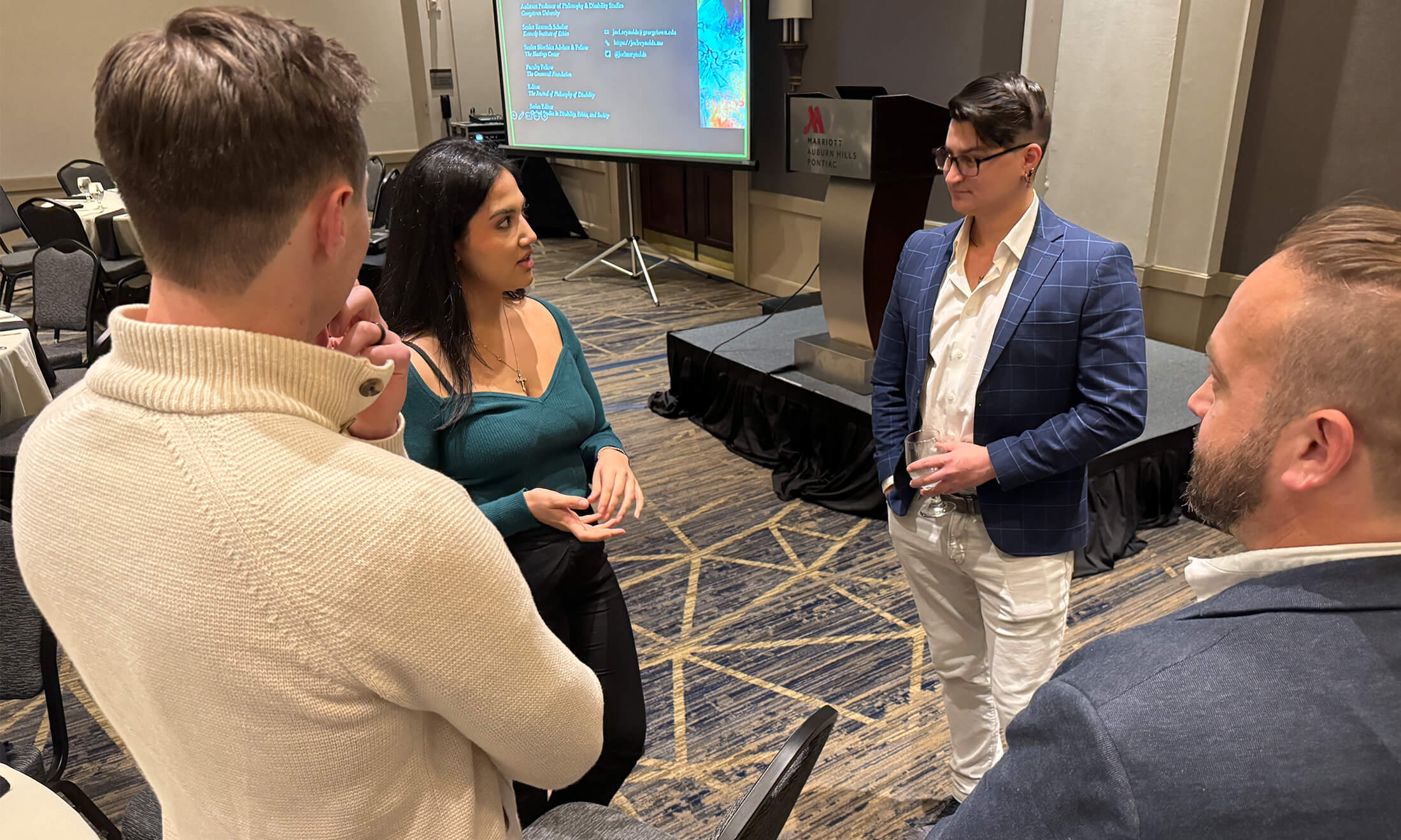 OUWB student talking with the speaker at the 2023 Krug lecture