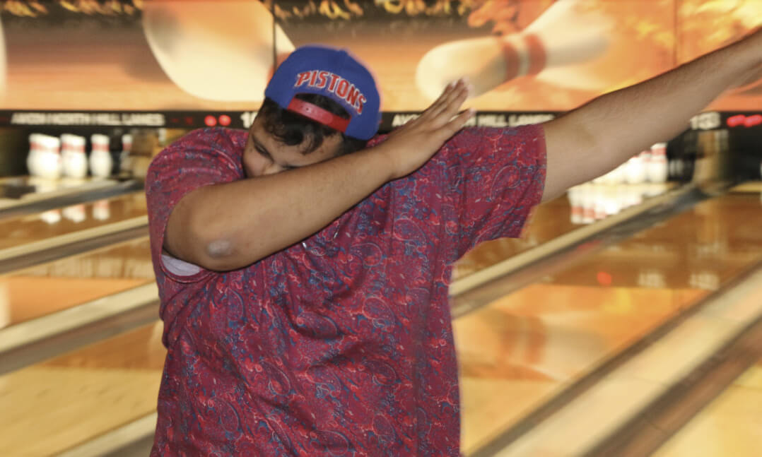 An image of OUWB students bowling and celebrating