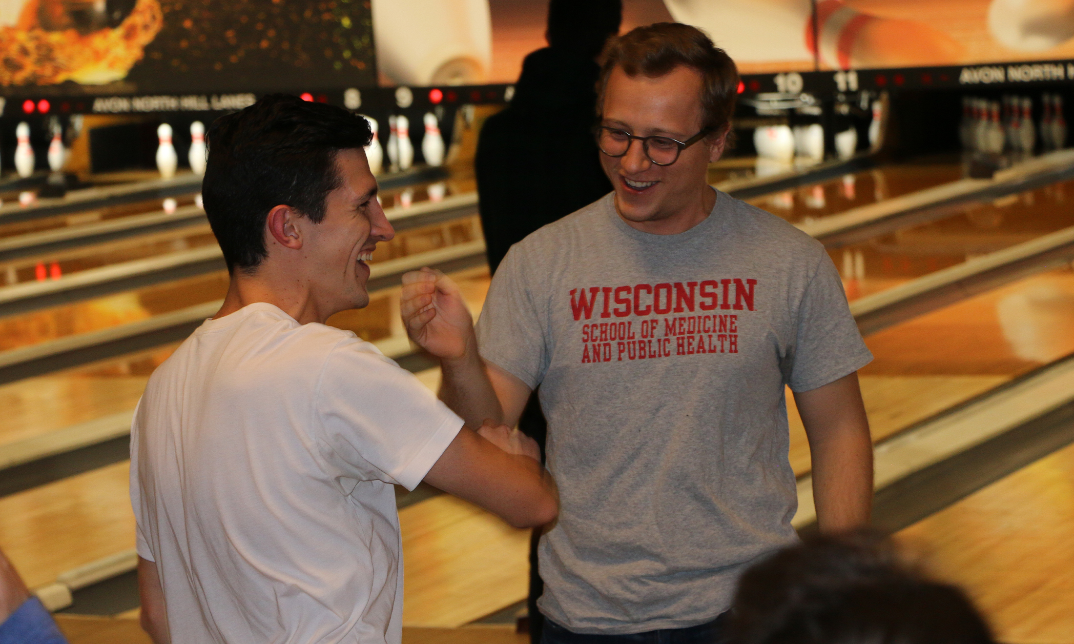 An image of OUWB students bowling and celebrating