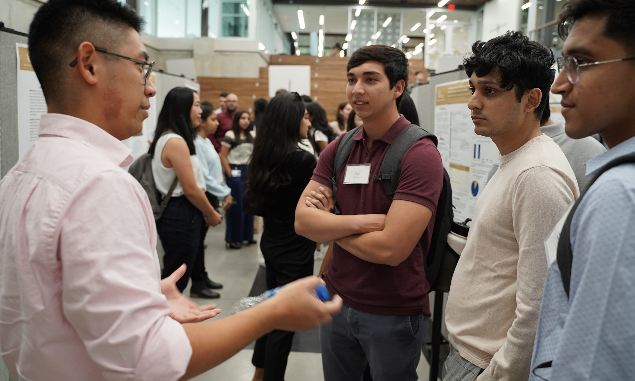 An image of Tai Metzger and classmates at a research event