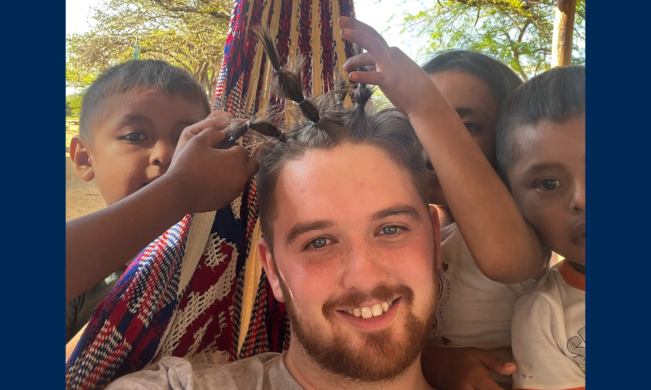 Quinn Simpson with local children