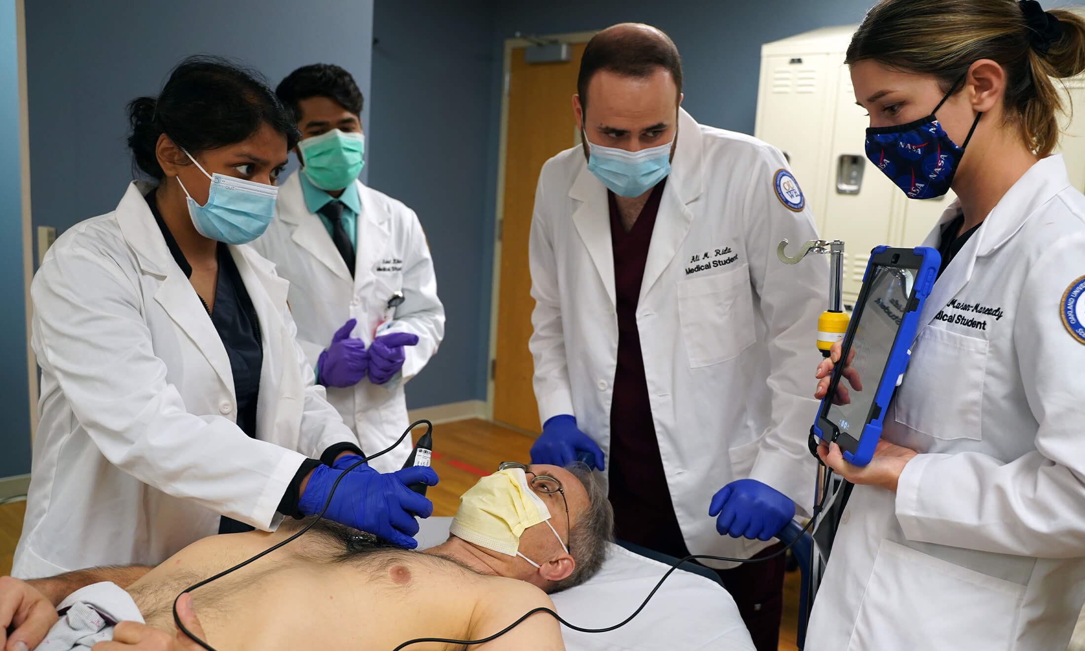 OUWB students using handheld ultrasound.