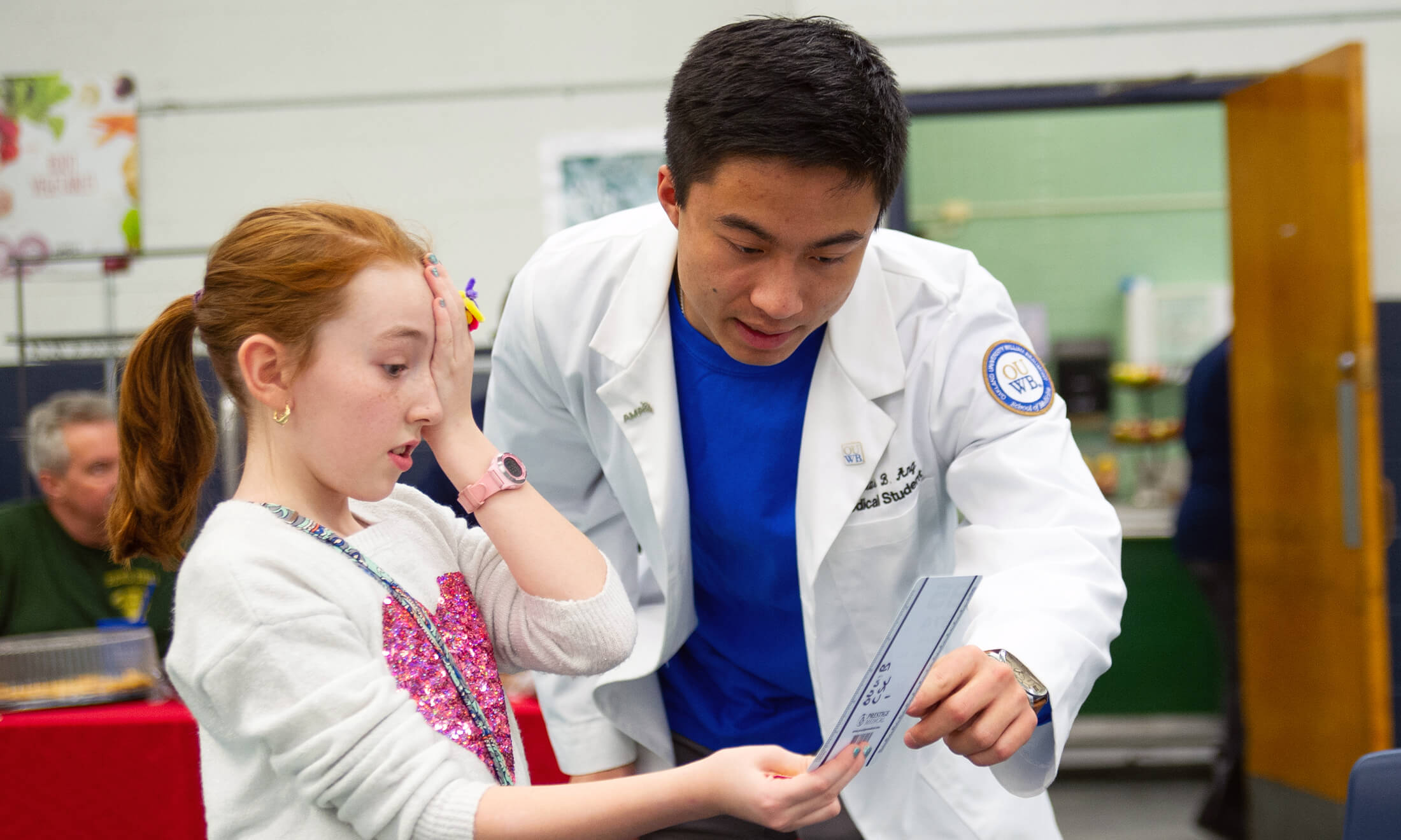 Medical student at a community health fair