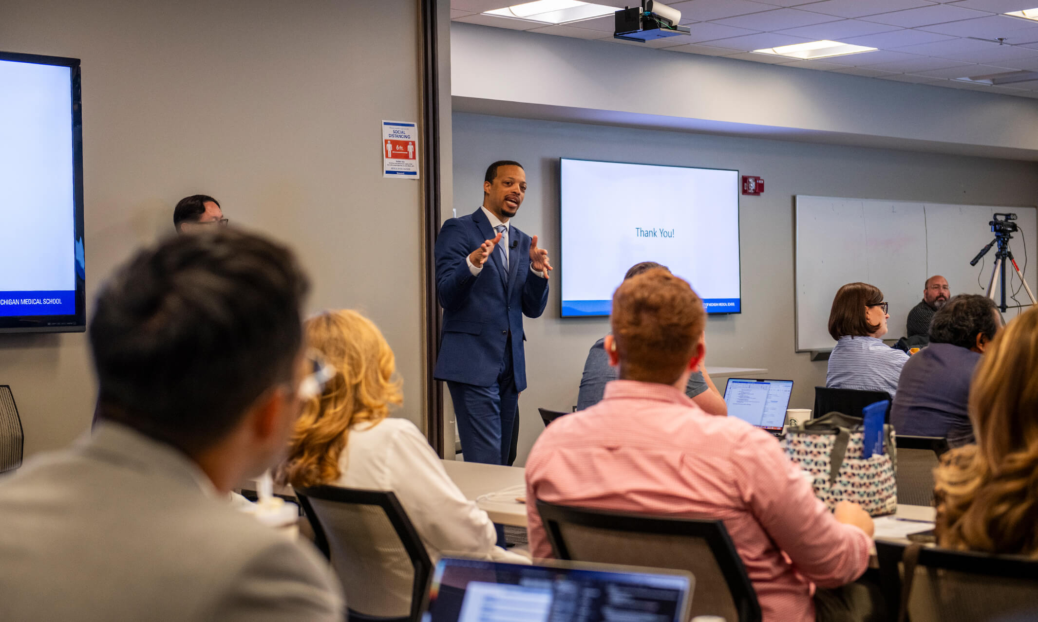 Cornelius James leading a session in a classroom for OUWB