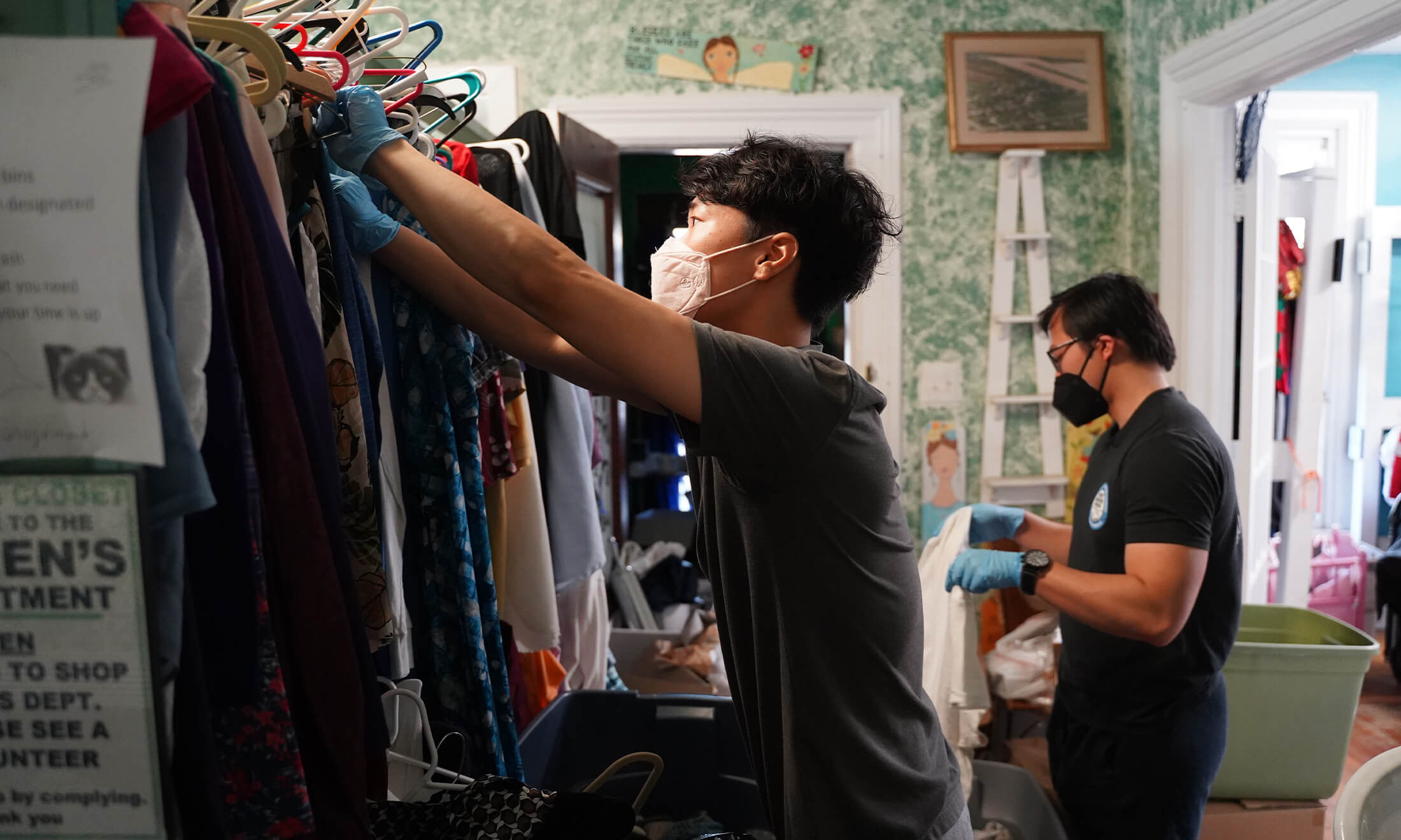 OUWB students volunteering at Baldwin Center by sorting clothes.