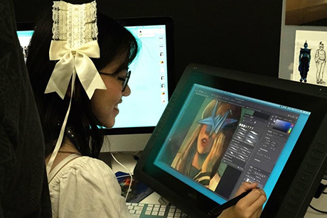 A student works on her tablet.