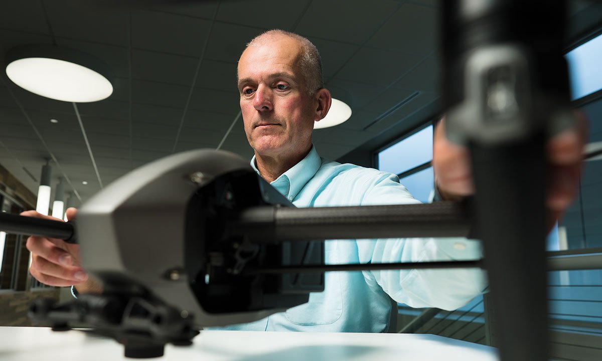 A man working on a drone.