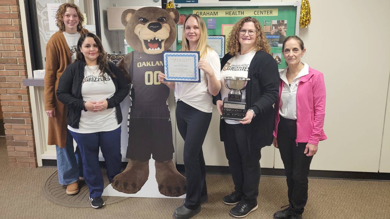 Graham Health Center staff with award for flu vaccination efforts