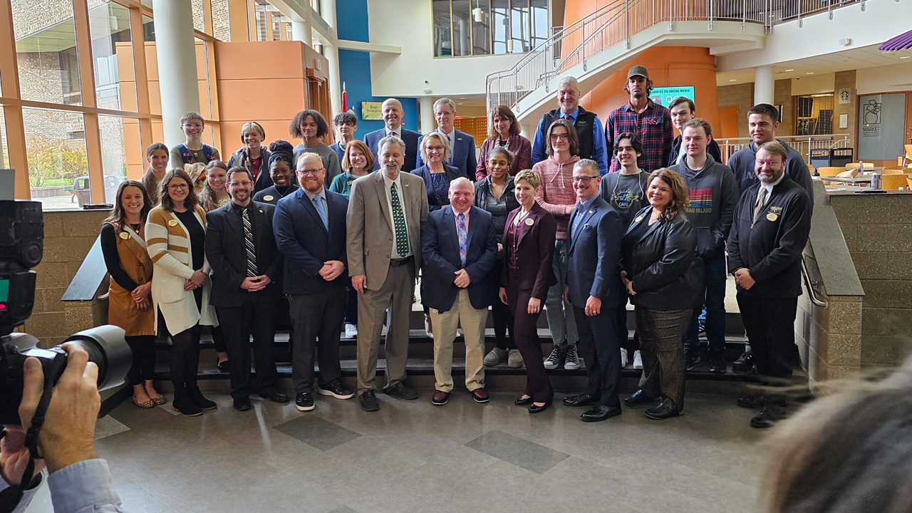 aGroup photo at transfer agreement signing