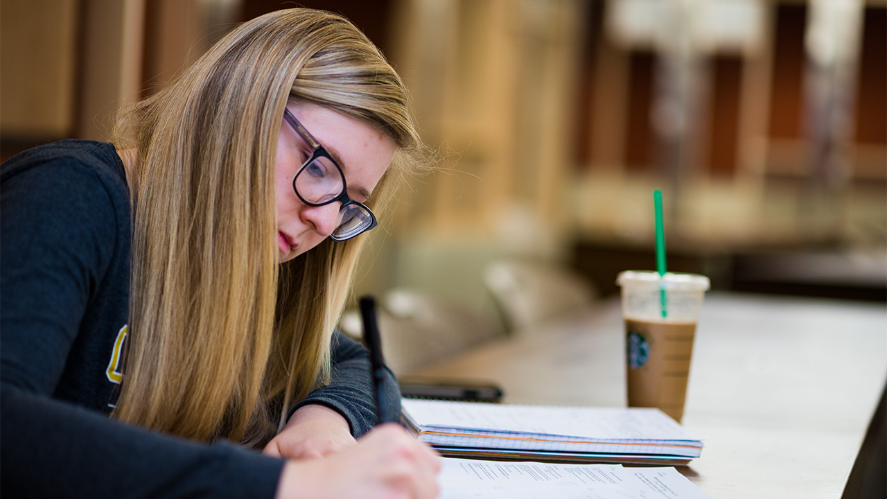 Student taking notes