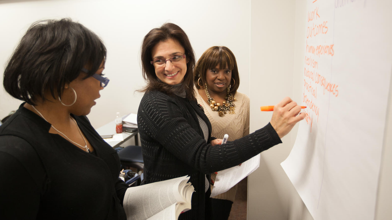 Student group at whiteboard