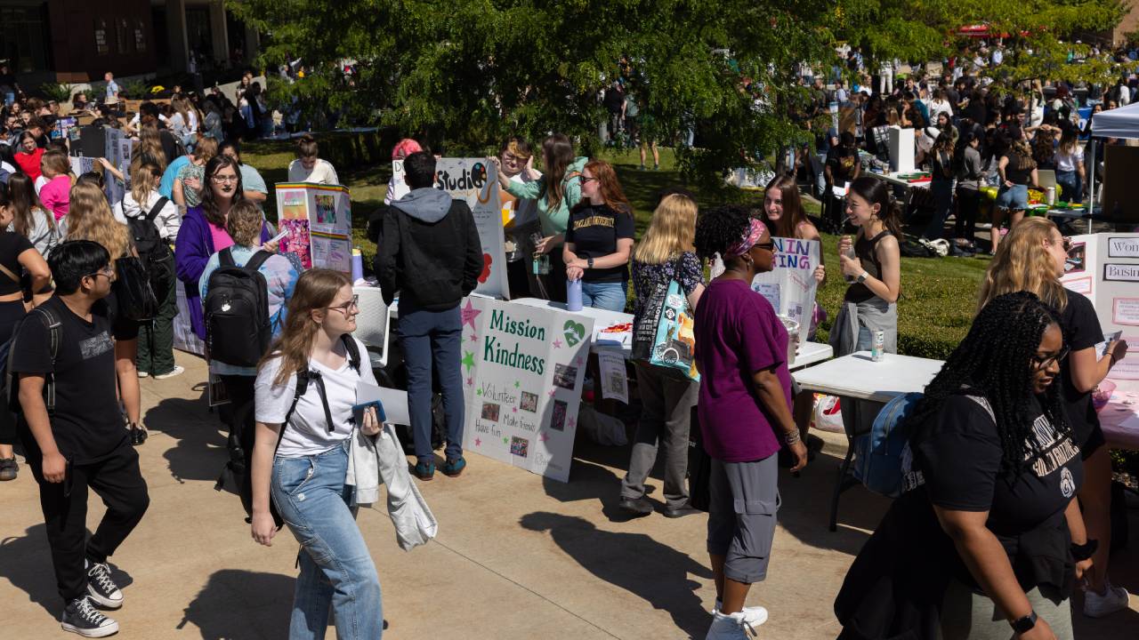 Students interacting with each other at Student Organization Fair