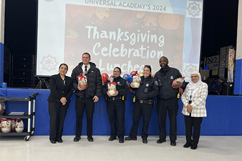 A group photo of professionals honored at Universal Academy at Thanksgiving
