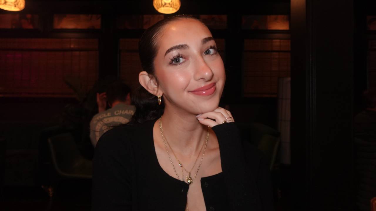 Isabel Abdal with head resting on hand