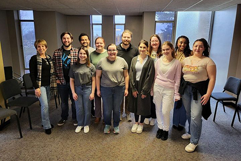 A group of people smiling.