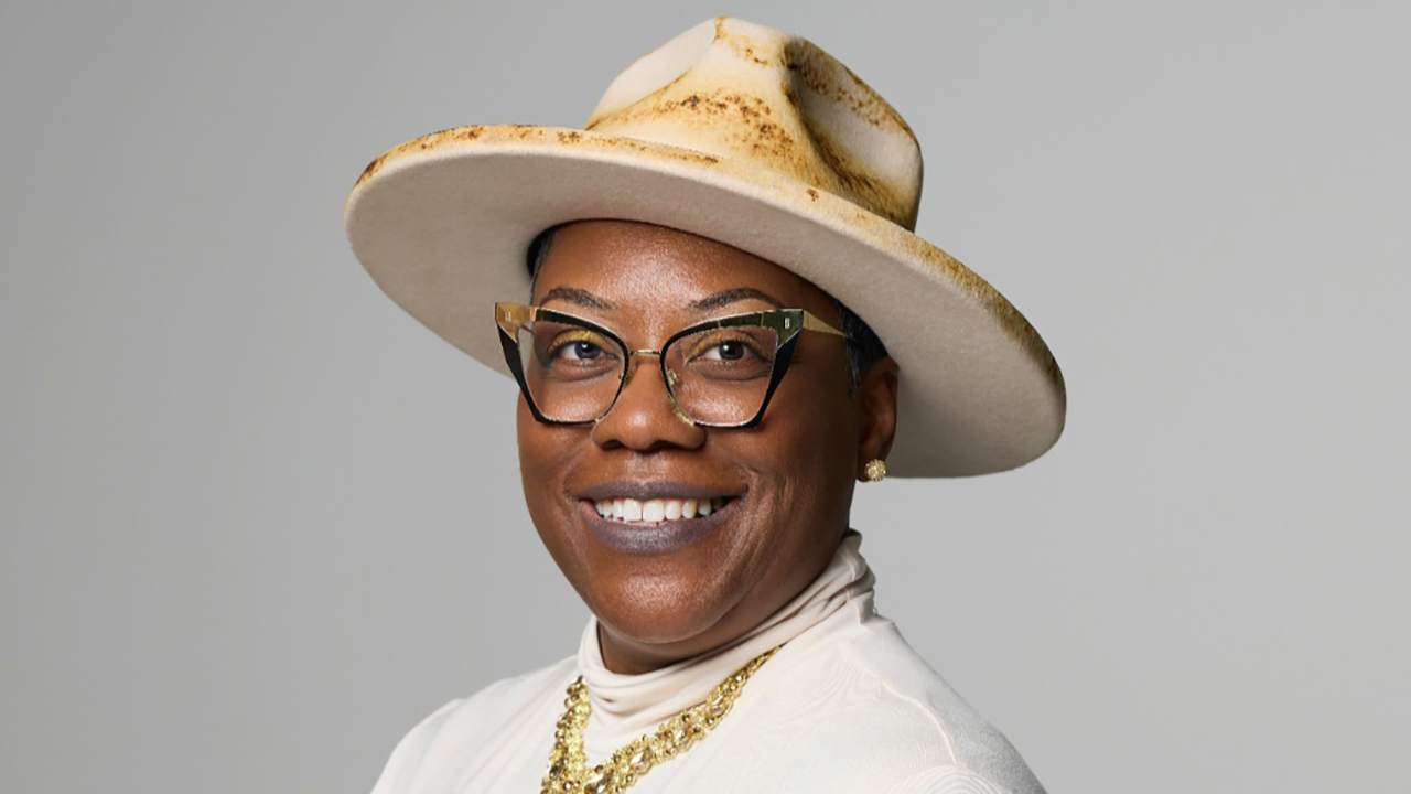 Headshot of Anetria Cole smiling in hate