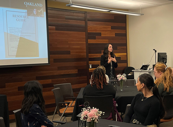A person speaking at a lecture