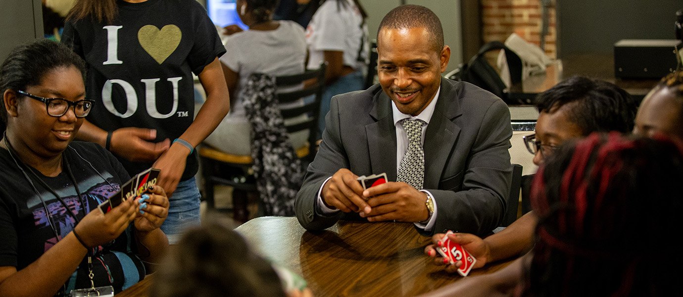 Omar and students playing UNO