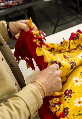 Hands working on a blanket