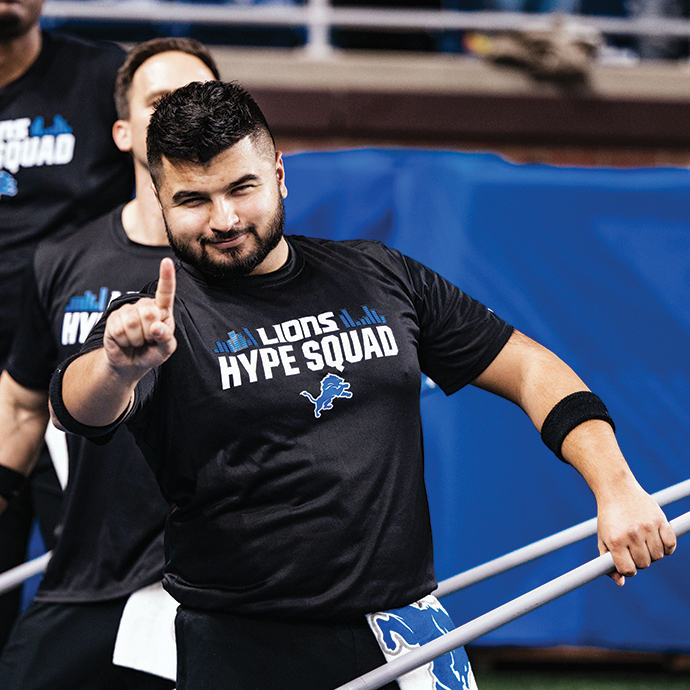 A man wagging his finger holding a flag