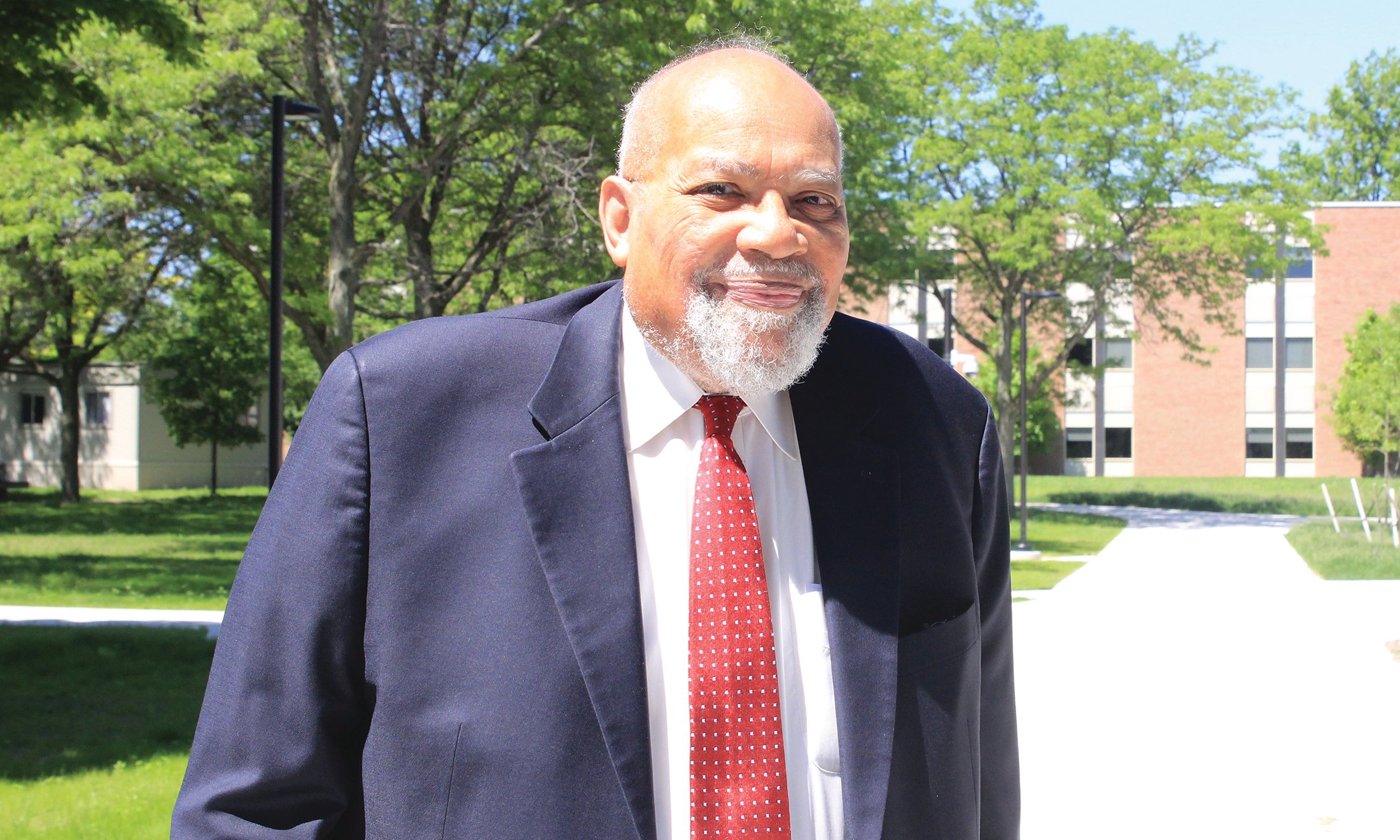 A man smiling outside.