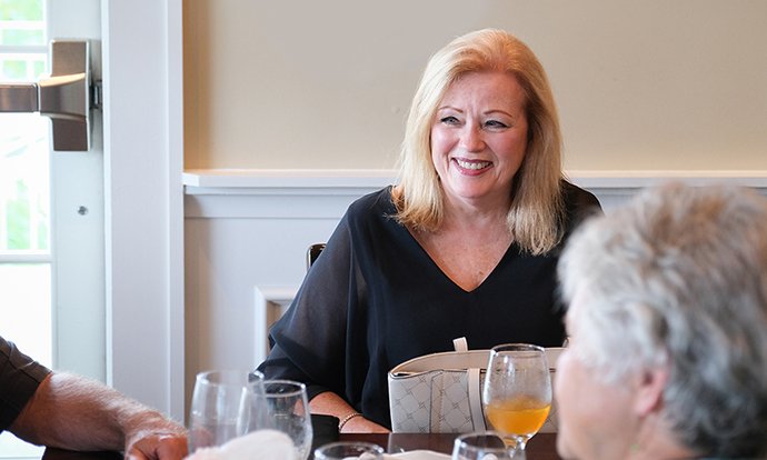 A woman sitting at a dinner table