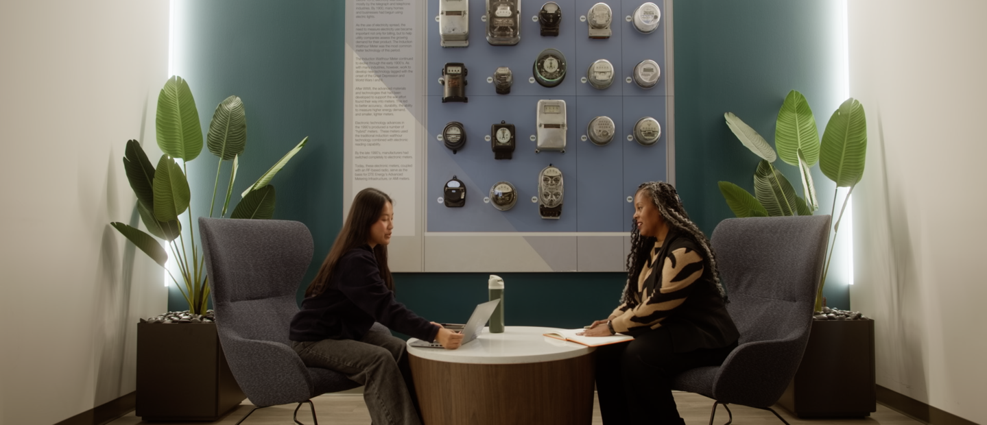 Two women seated across from each other