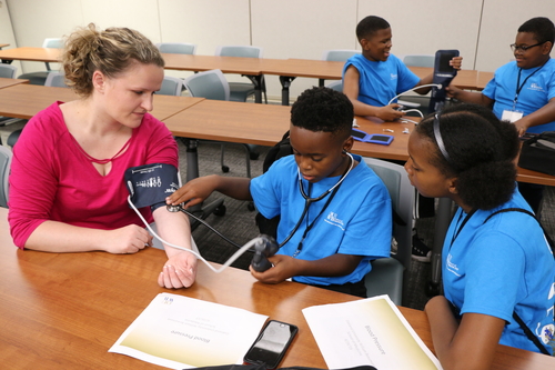 An image of a medical student with program participants
