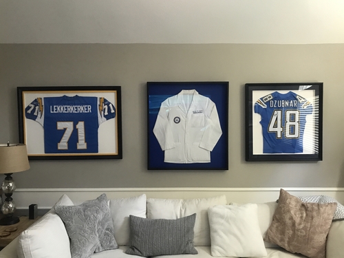 An image of two jerseys and a white coat