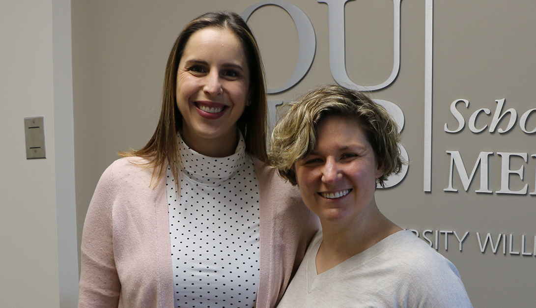 An image of two faculty members