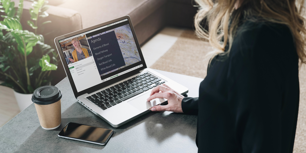 An image of a person at a computer