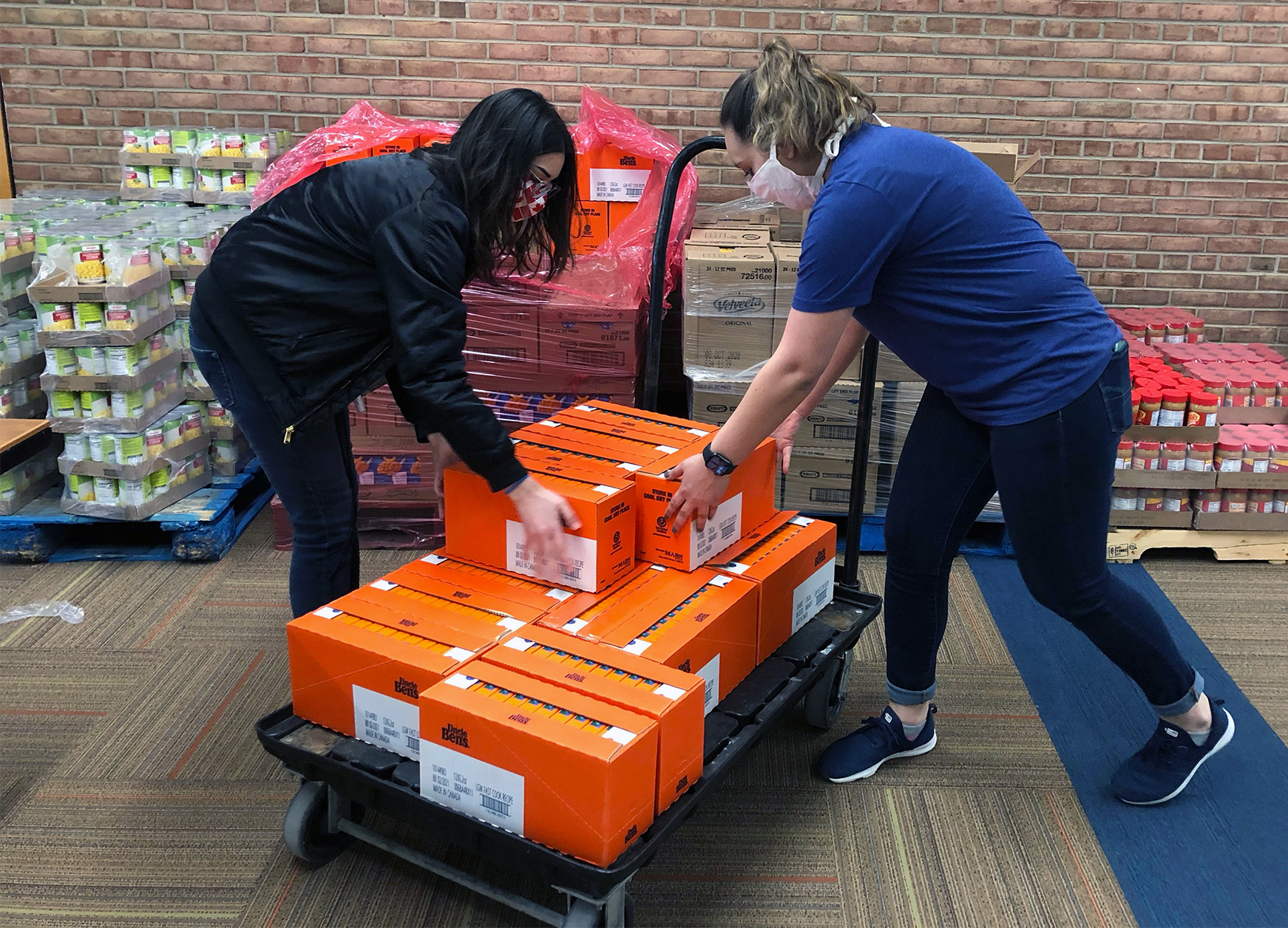 An image of students loading a cart