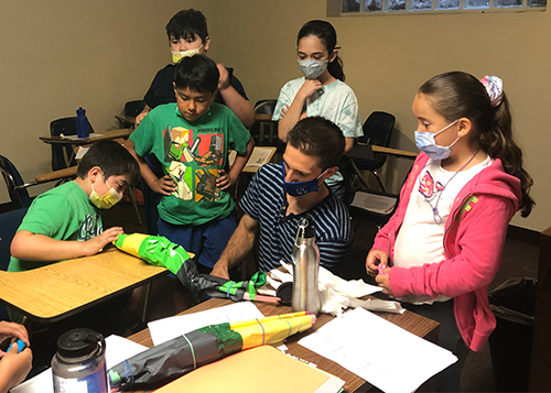 An image of an OUWB student with camp goers