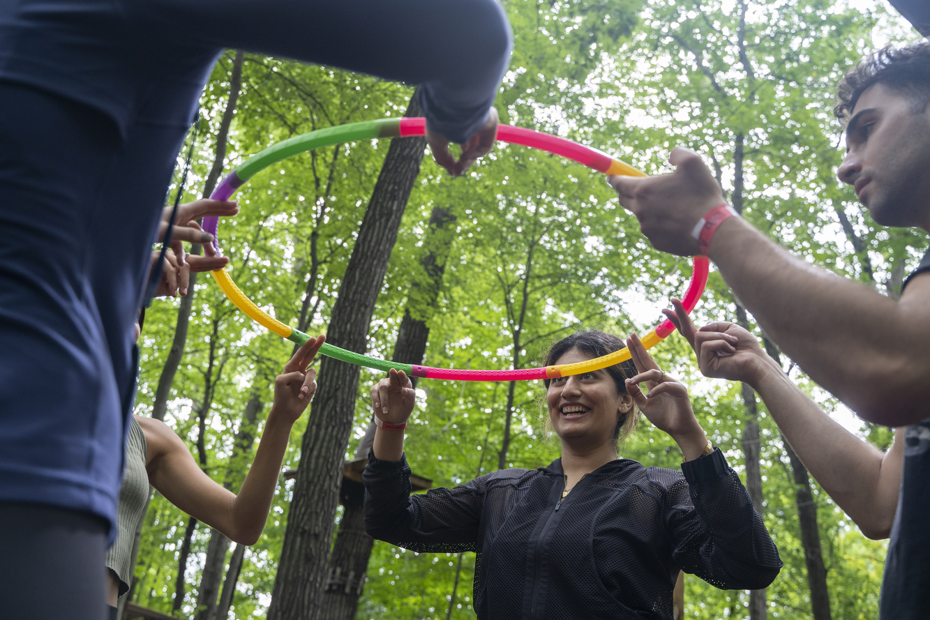 An image of students holding a hula hoop