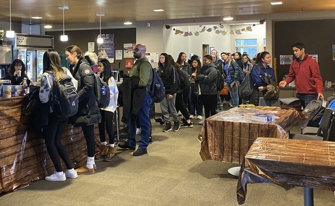 An image of students in line