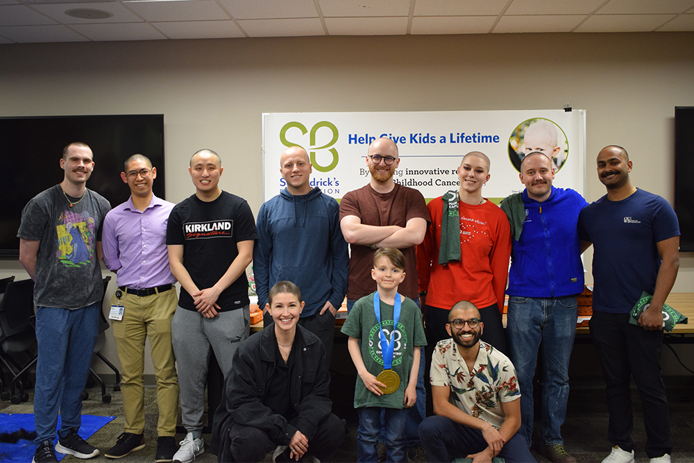 An image of a group of students who had their heads shaved
